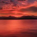 USA, Washington State, Seabeck. Vivid sunset over Hood Canal and Olympic Mountains. Art Print